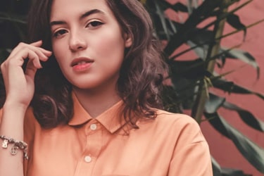 woman wearing peach polo shirt